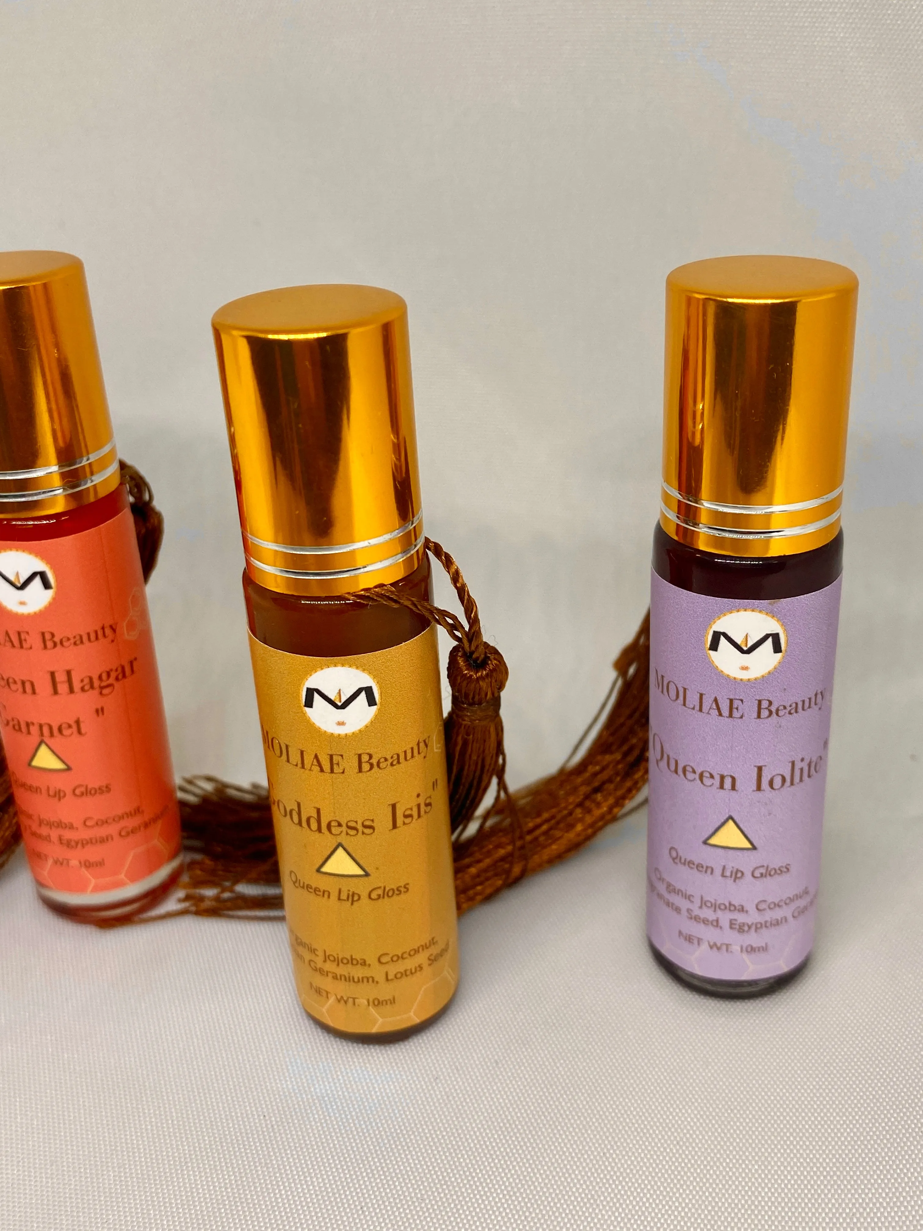 Topaz Oasis Queen | Queen Hagar Garnet | Lip Oil Gloss | Strawberry Seed | Egyptian Geranium | Jojoba | Coconut